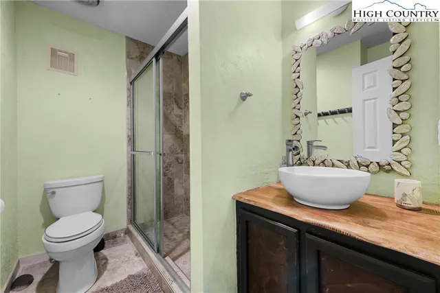 a kitchen with stainless steel appliances granite countertop a stove and a refrigerator