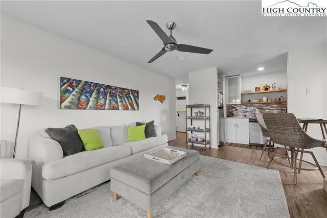 a living room with furniture fireplace and a flat screen tv