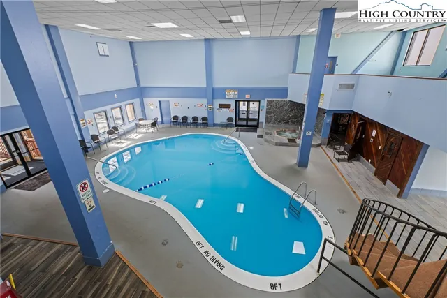 a view of a swimming pool and a tables