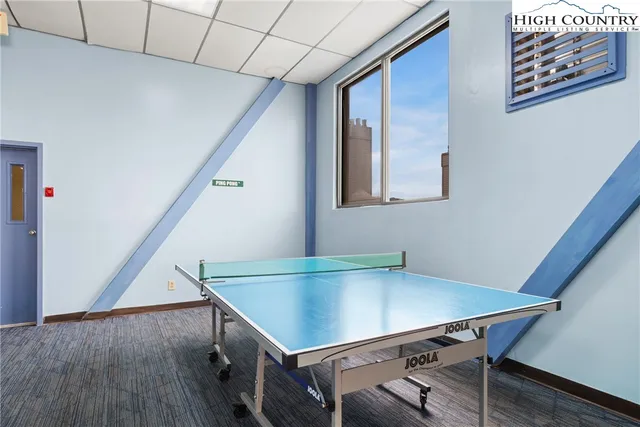 a view of a room with furniture and wooden floor