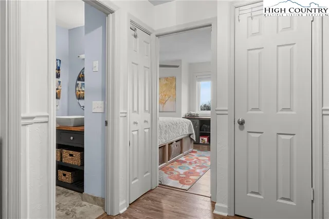 a bedroom with a bed and a lamp