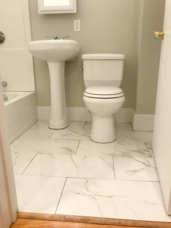 9 Colonial Road Milford, MA 01757 - Photo 11 of 16 a bathroom with a sink toilet and a mirror