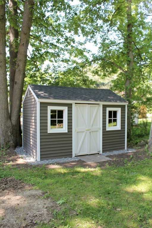 9 Colonial Road Milford, MA 01757 - Photo 16 of 16 a front view of house with yard