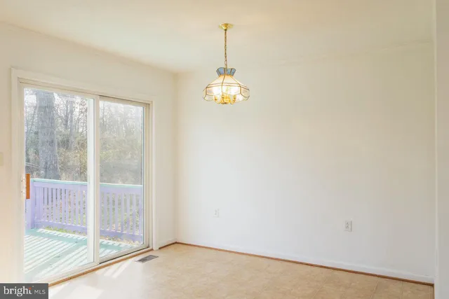 a kitchen with stainless steel appliances granite countertop a stove a sink dishwasher and a microwave oven with cabinets