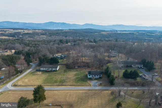 a front view of house with yard and trees