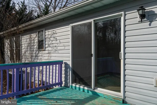 a view of a yard with chairs