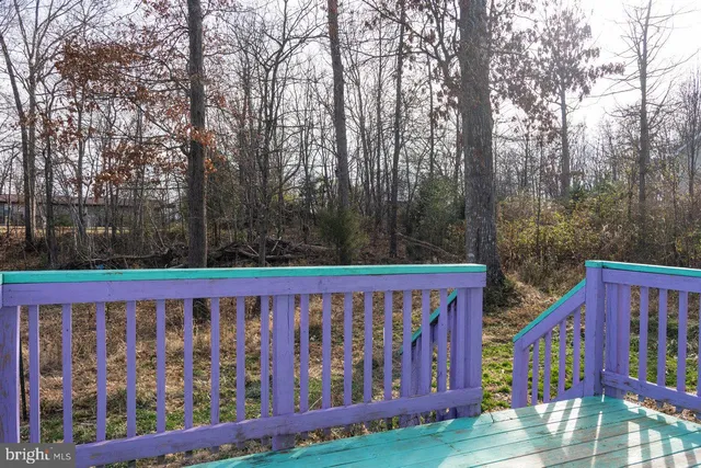 a view of a pool with a yard