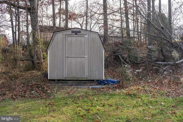 a view of a backyard with a lake view and mountain view