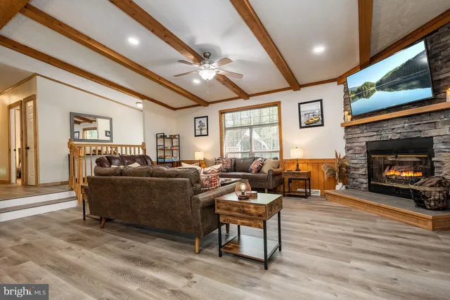 a living room with furniture and a fireplace