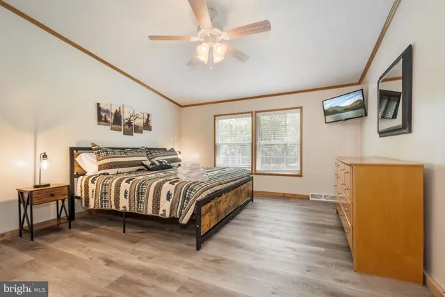 a bedroom with a large bed and a window