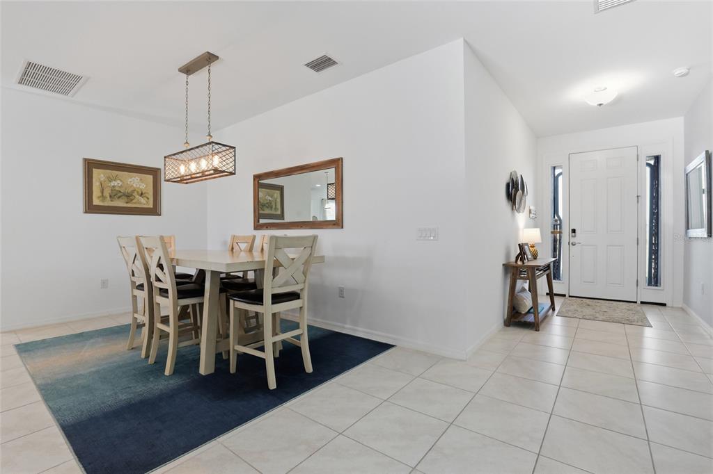 14879 Wichita Road Port Charlotte, FL 33981 - Photo 15 of 45 a view of a dining room with furniture