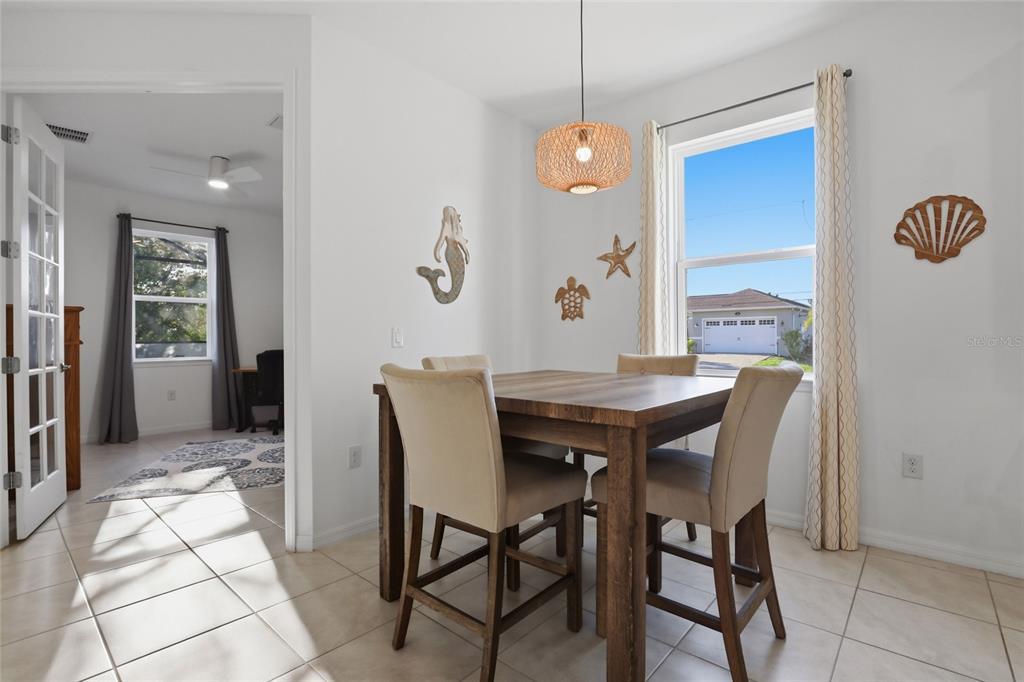14879 Wichita Road Port Charlotte, FL 33981 - Photo 17 of 45 a view of a dining room with furniture and chandelier