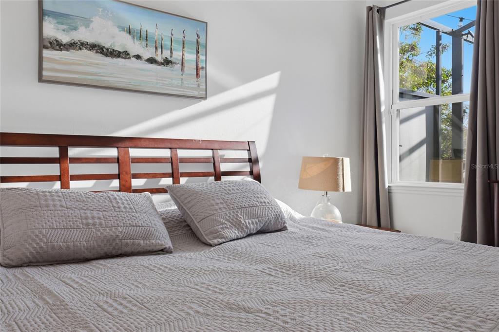 14879 Wichita Road Port Charlotte, FL 33981 - Photo 20 of 45 a bedroom with a bed and a painting on the wall