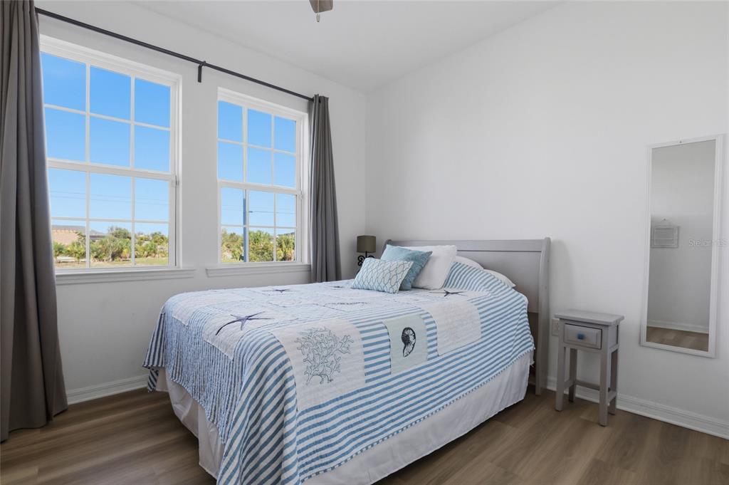 14879 Wichita Road Port Charlotte, FL 33981 - Photo 24 of 45 a bedroom with a bed and a window