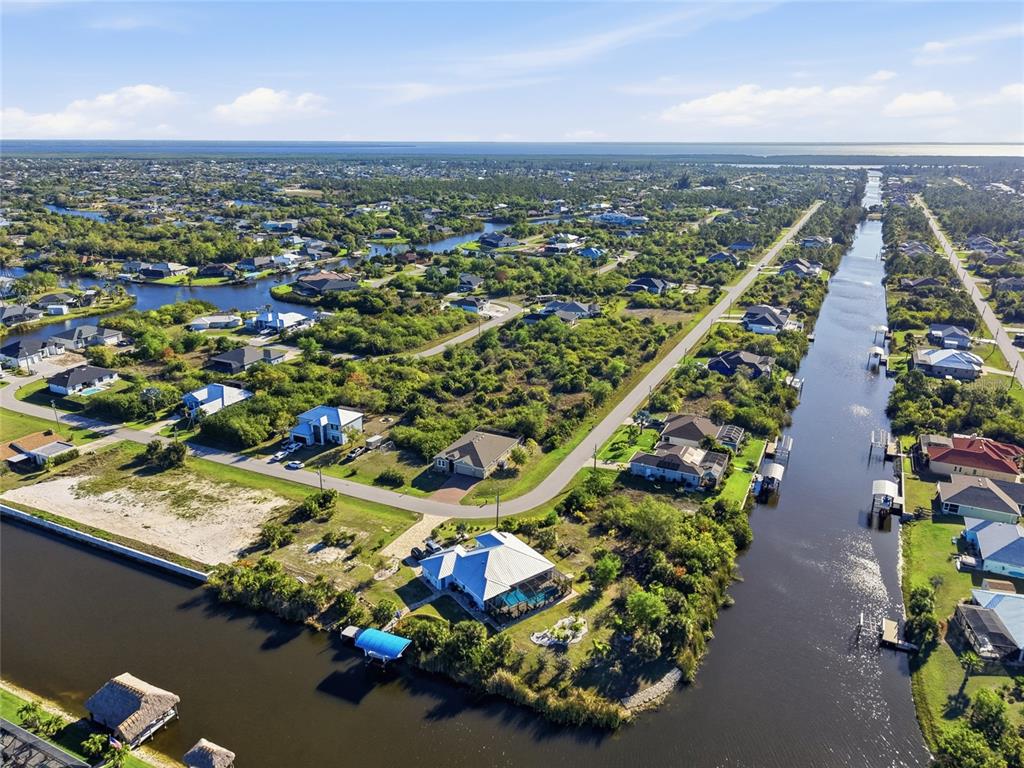 14879 Wichita Road Port Charlotte, FL 33981 - Photo 42 of 45 an aerial view of residential houses with outdoor space
