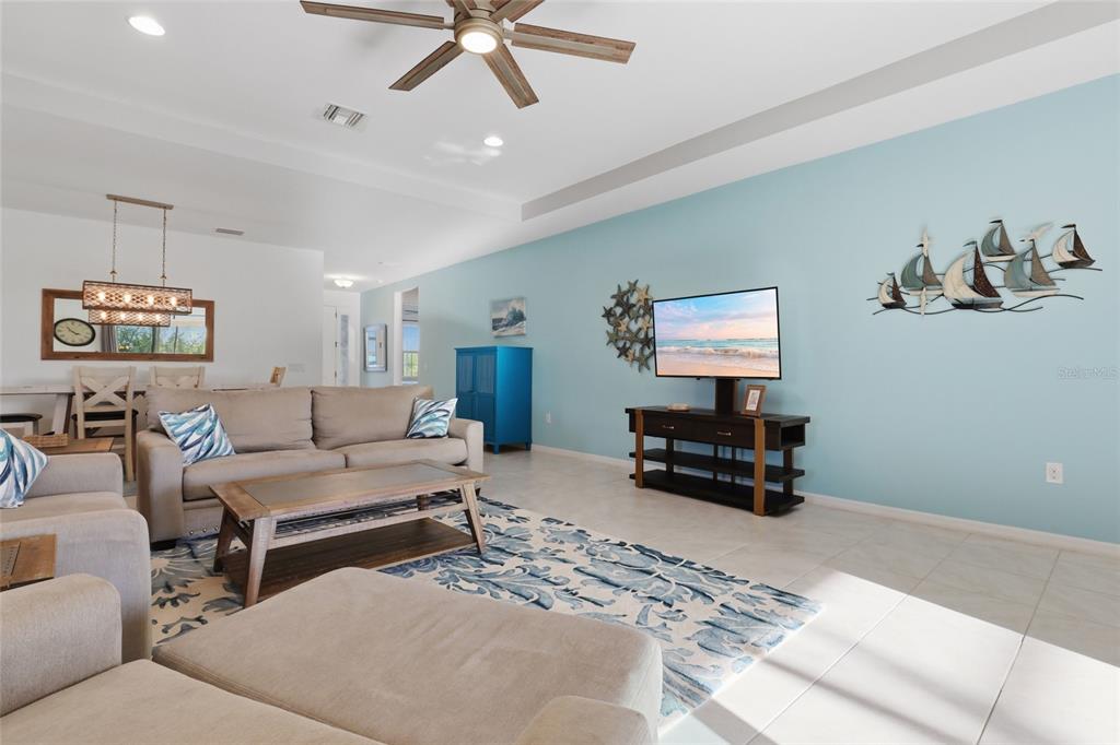 14879 Wichita Road Port Charlotte, FL 33981 - Photo 7 of 45 a living room with furniture and a flat screen tv