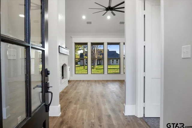 a view of an entryway with wooden floor