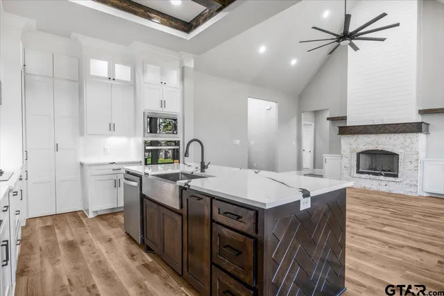 a kitchen with a stove a sink and a refrigerator