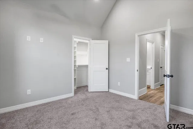 an empty room with closet area