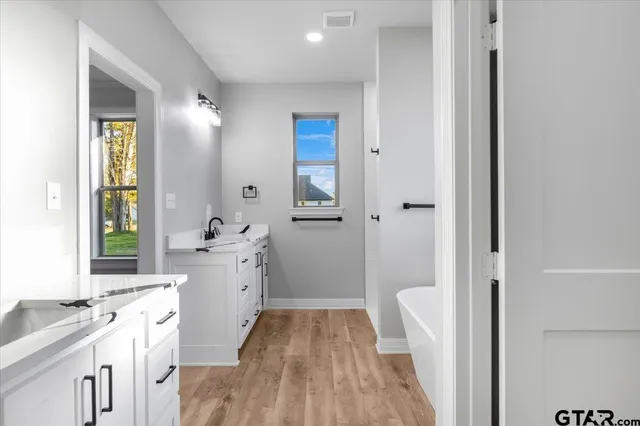 a view of a livingroom with an empty space and a hallway