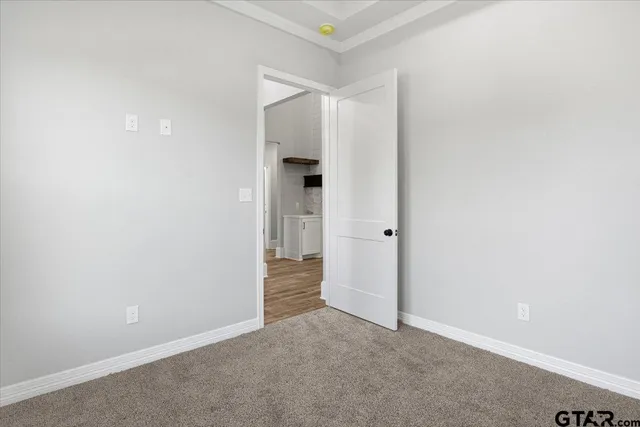 a bathroom with a sink vanity and mirror