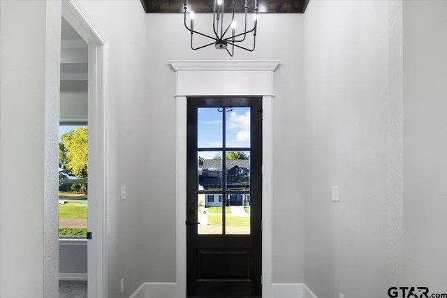 a view of a livingroom with a fireplace and a window
