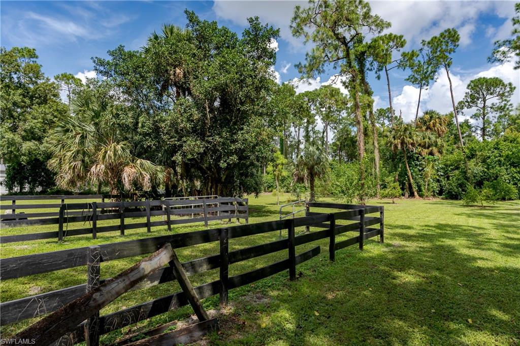 3301 31st Avenue Southwest Naples, FL 34117 - Photo 22 of 22 a view of a bench in a park