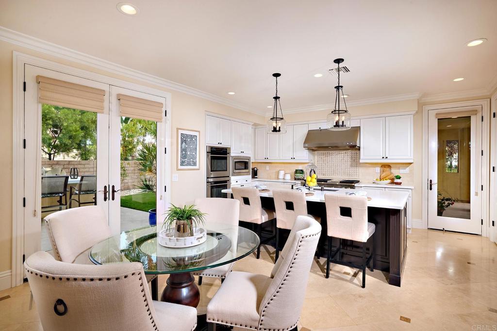 6895 Amber Lane Carlsbad, CA 92009 - Photo 11 of 45 a view of kitchen with appliances dining table and chairs