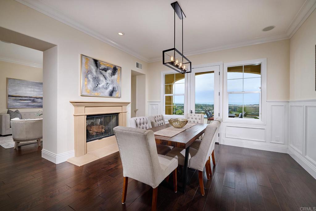6895 Amber Lane Carlsbad, CA 92009 - Photo 17 of 45 a view of a dining room with furniture window and wooden floor