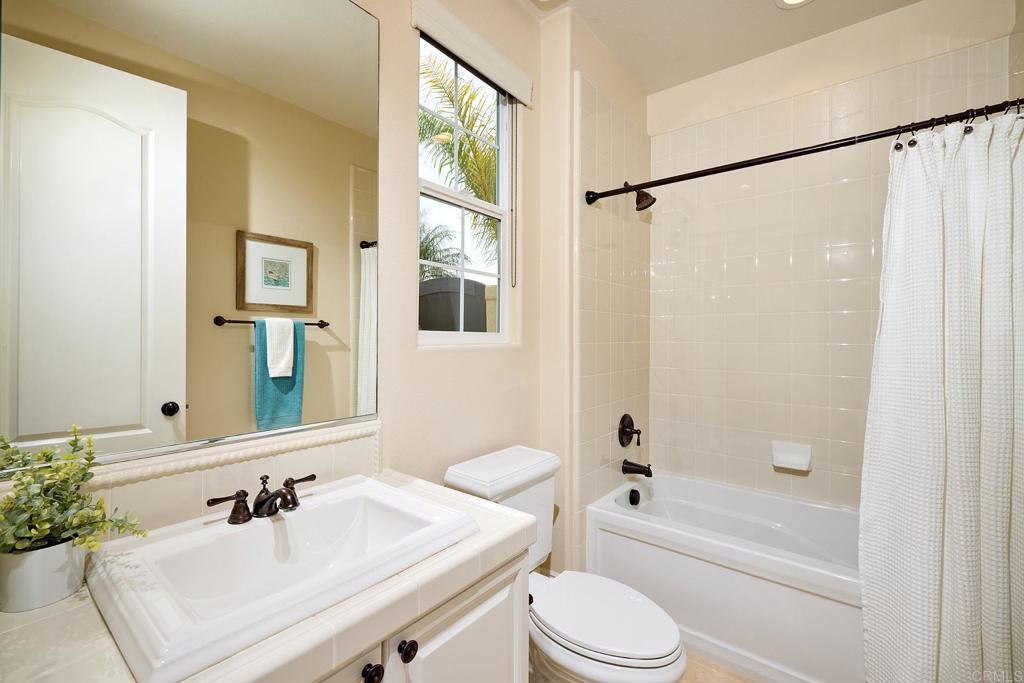 6895 Amber Lane Carlsbad, CA 92009 - Photo 21 of 45 a bathroom with a sink a toilet and shower