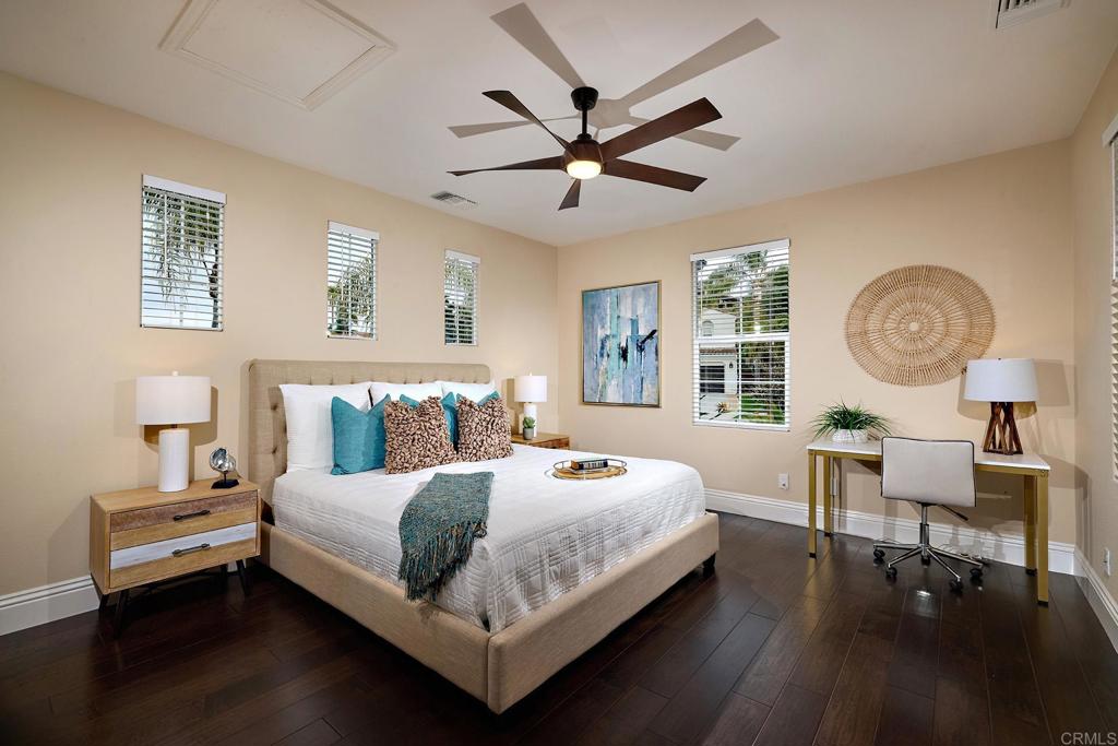6895 Amber Lane Carlsbad, CA 92009 - Photo 22 of 45 a bedroom with a bed a dresser and chair