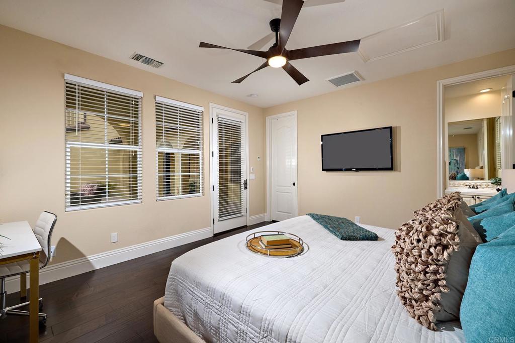 6895 Amber Lane Carlsbad, CA 92009 - Photo 23 of 45 a bedroom with a bed and a flat screen tv
