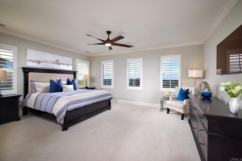 6895 Amber Lane Carlsbad, CA 92009 - Photo 27 of 45 a spacious bedroom with a bed couch and windows
