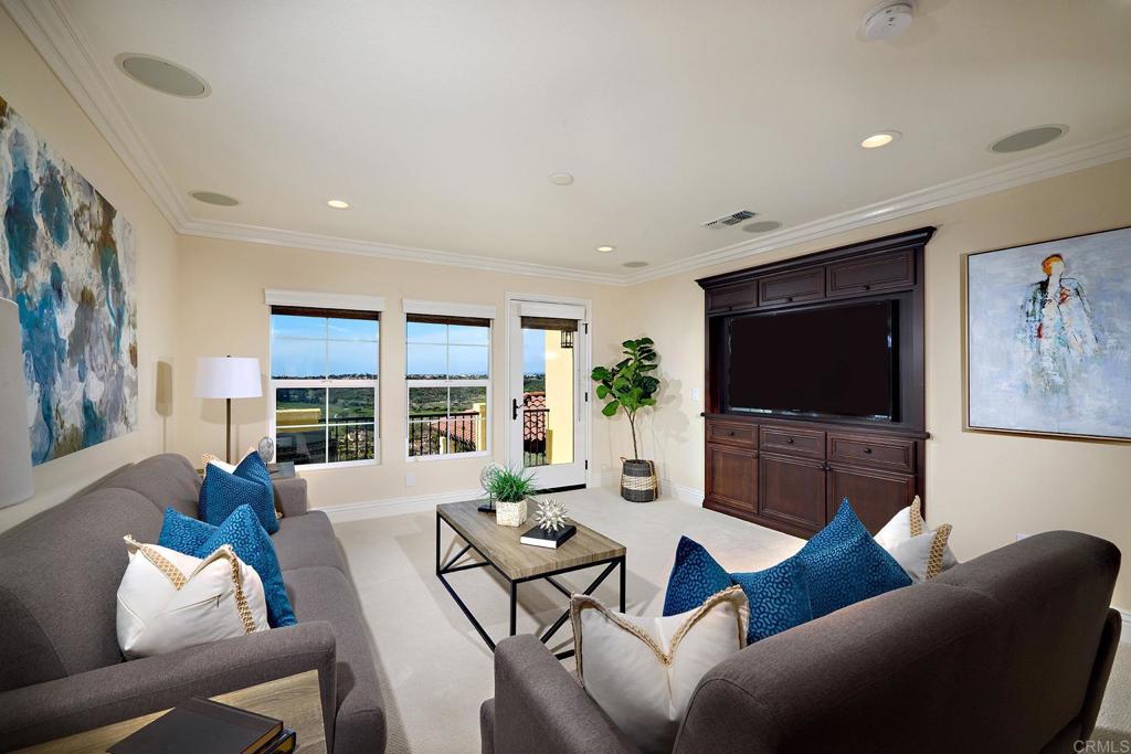 6895 Amber Lane Carlsbad, CA 92009 - Photo 35 of 45 a living room with furniture a flat screen tv and a large window