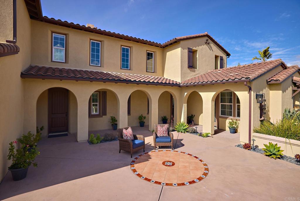 6895 Amber Lane Carlsbad, CA 92009 - Photo 10 of 45 a group of people sitting in front of a house