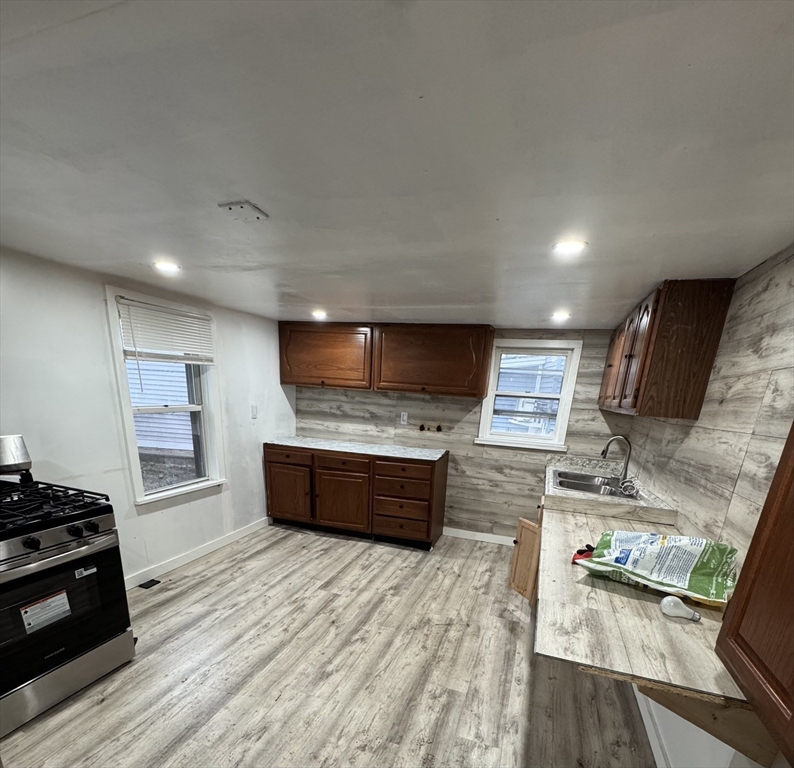 731 Bay Street Fall River, MA 02724 - Photo 4 of 12 a room with furniture and a flat screen tv