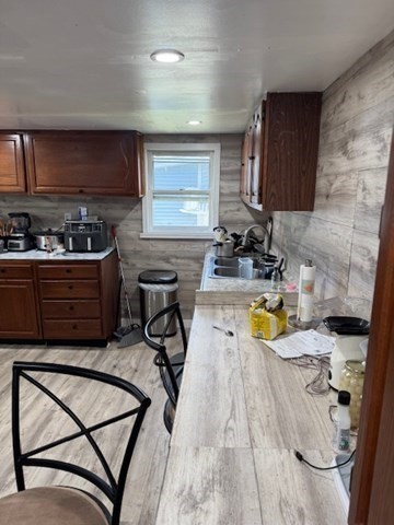 731 Bay Street Fall River, MA 02724 - Photo 5 of 12 a view of a kitchen with kitchen island dining table and chairs
