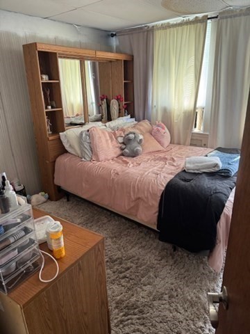 731 Bay Street Fall River, MA 02724 - Photo 7 of 12 a bedroom with a bed and a window