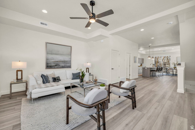 4016 South Burch Way Ogden, UT 84405 - Photo 3 of 30 Spacious living area featuring wood-finish flooring, recessed lighting, and a modern ceiling fan