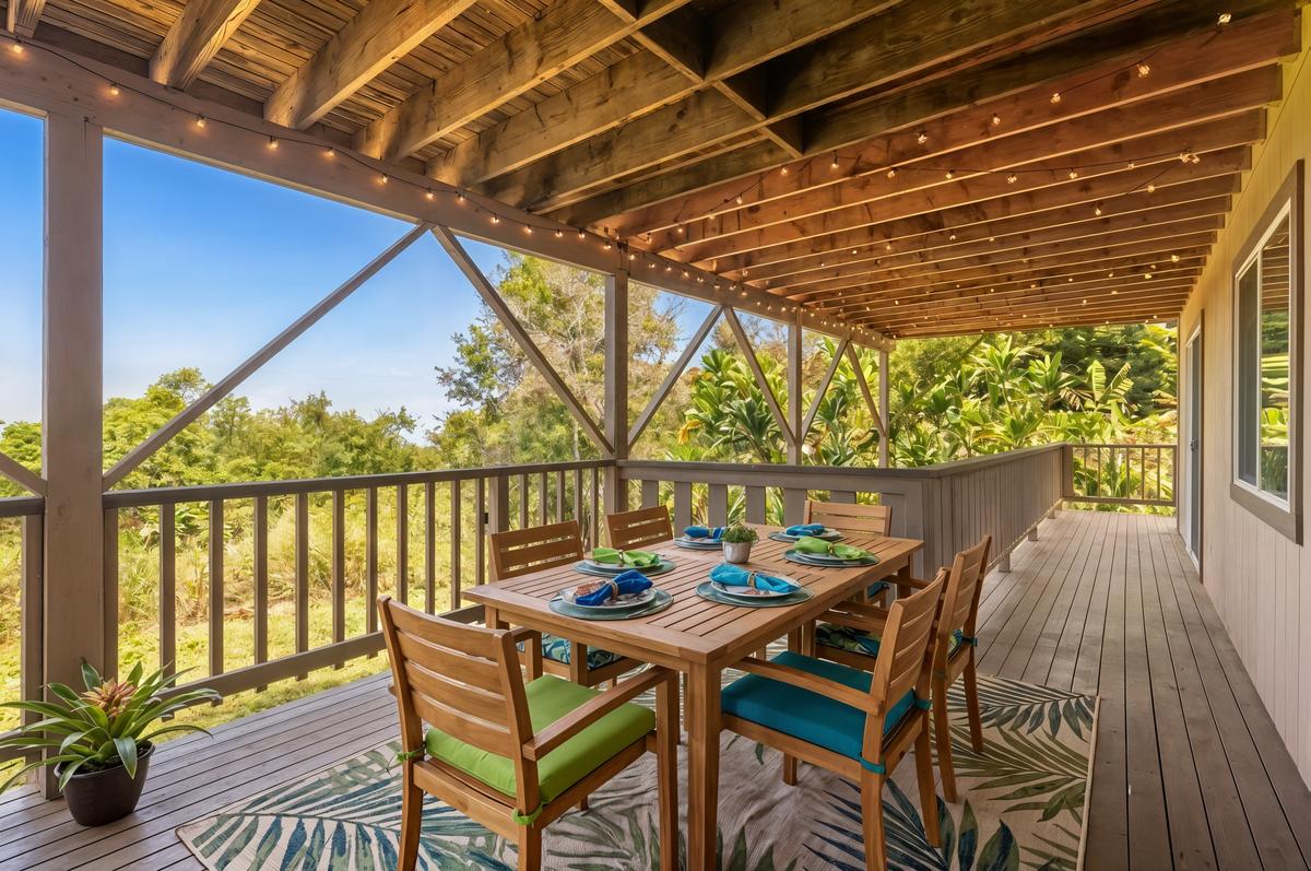 81-6315 Hawaiʻi Belt Road Captain Cook, HI 96750 - Photo 20 of 25 a view of a balcony dining area with furniture