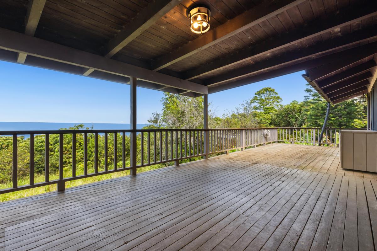 81-6315 Hawaiʻi Belt Road Captain Cook, HI 96750 - Photo 2 of 25 a view of a balcony with wooden floor