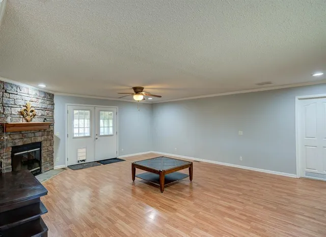 a living room with a couch and fireplace