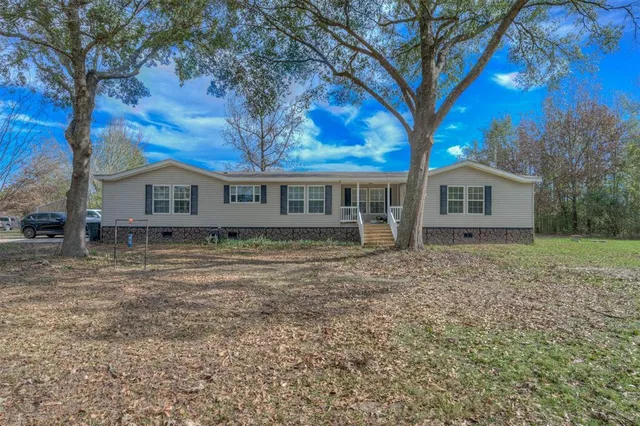 front view of a house with a trees