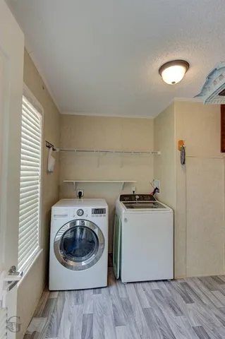 a kitchen with a stove top oven and cabinets