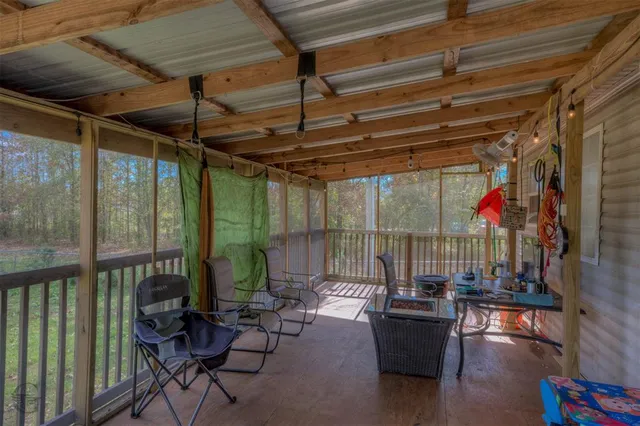 a view of a chairs and table in a patio