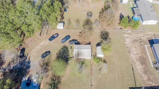 an aerial view of residential house with outdoor space