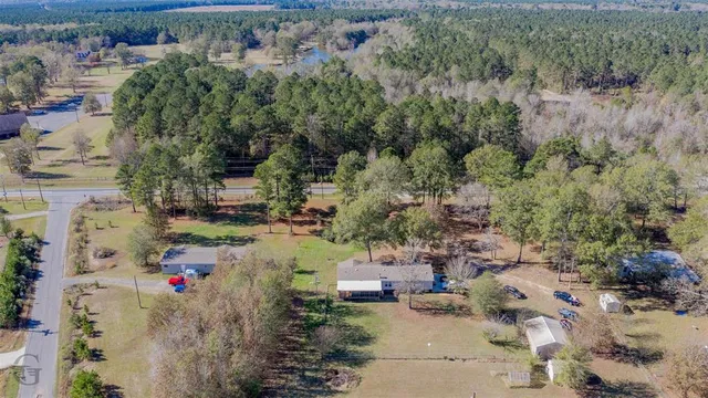 an aerial view of a houses with outdoor space
