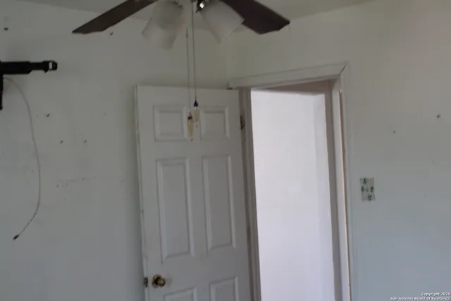 a view of a hallway with a shower