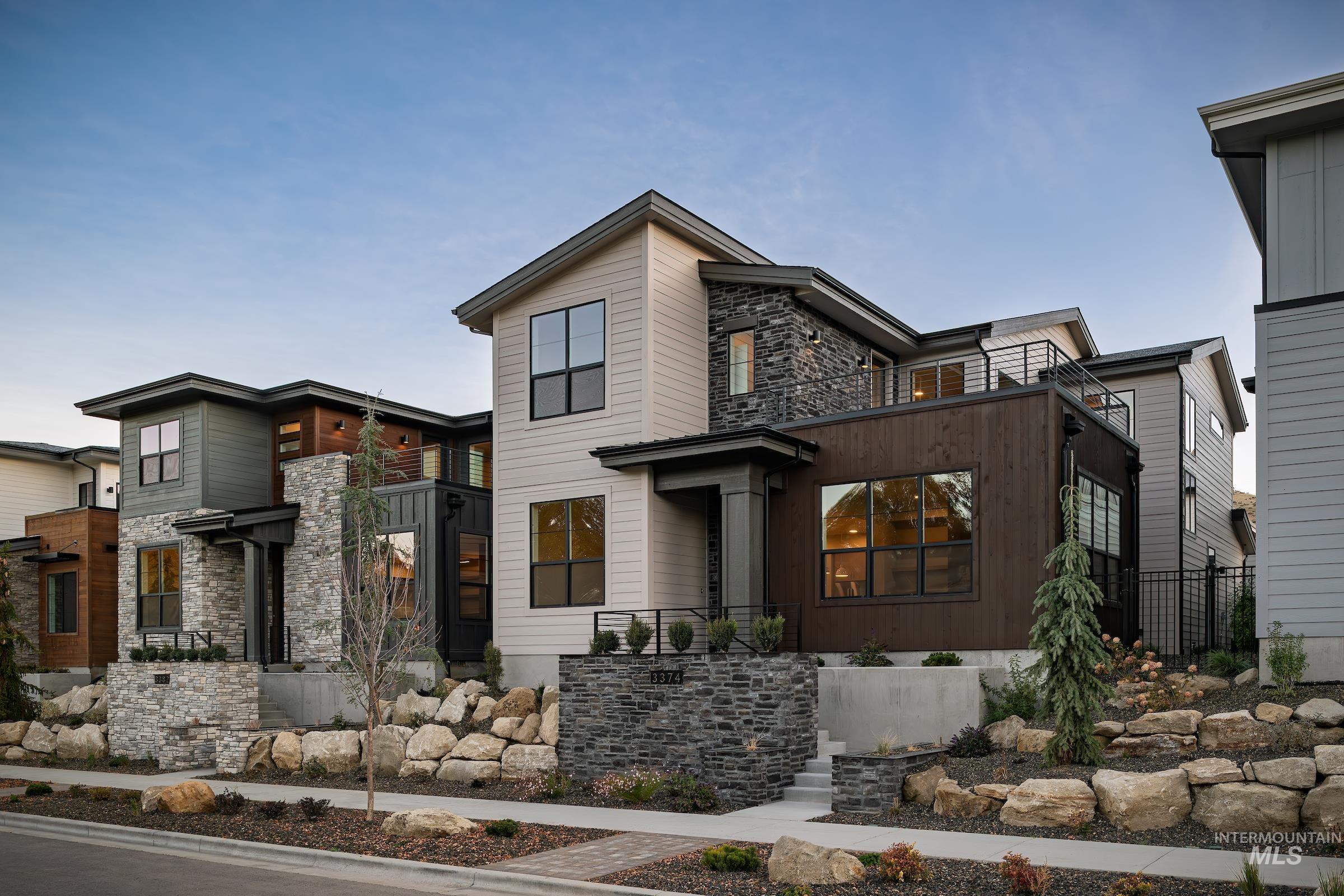 3374 West Neville Rnch Drive Boise, ID 83714 - Photo 1 of 37 Modern home with stone siding and a balcony