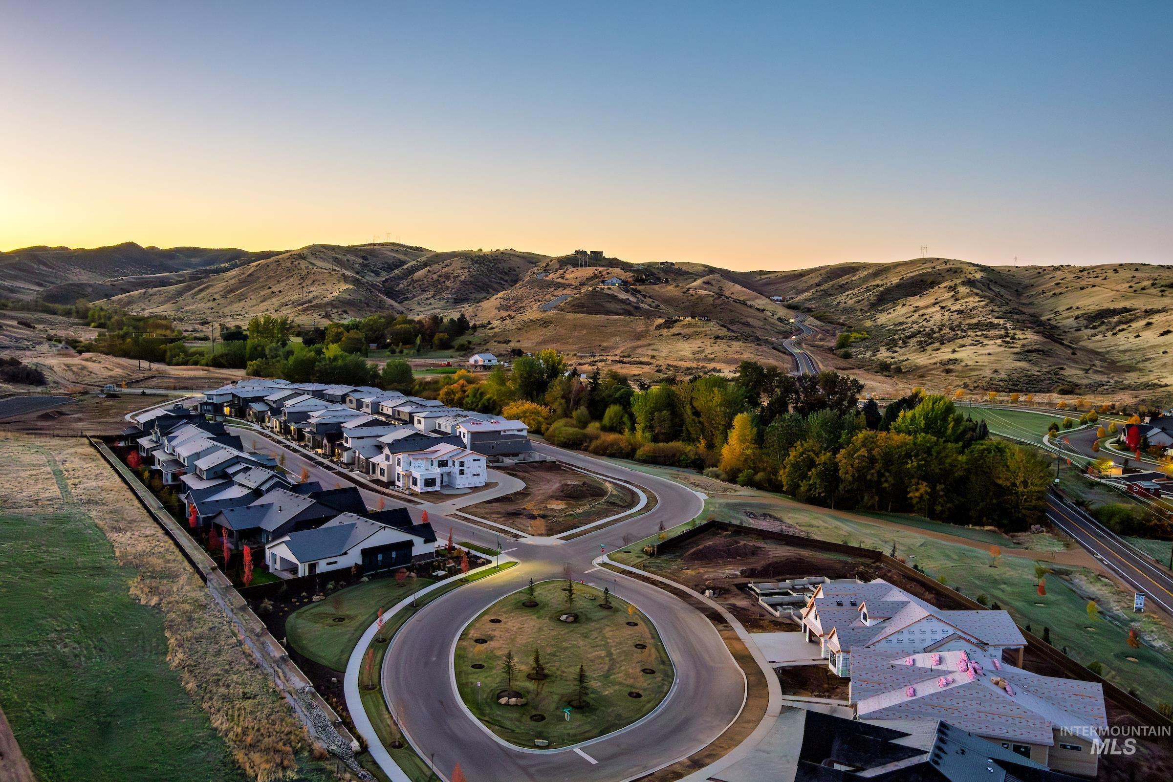 3374 West Neville Rnch Drive Boise, ID 83714 - Photo 11 of 37 Aerial view at dusk of a residential view and a mountain view